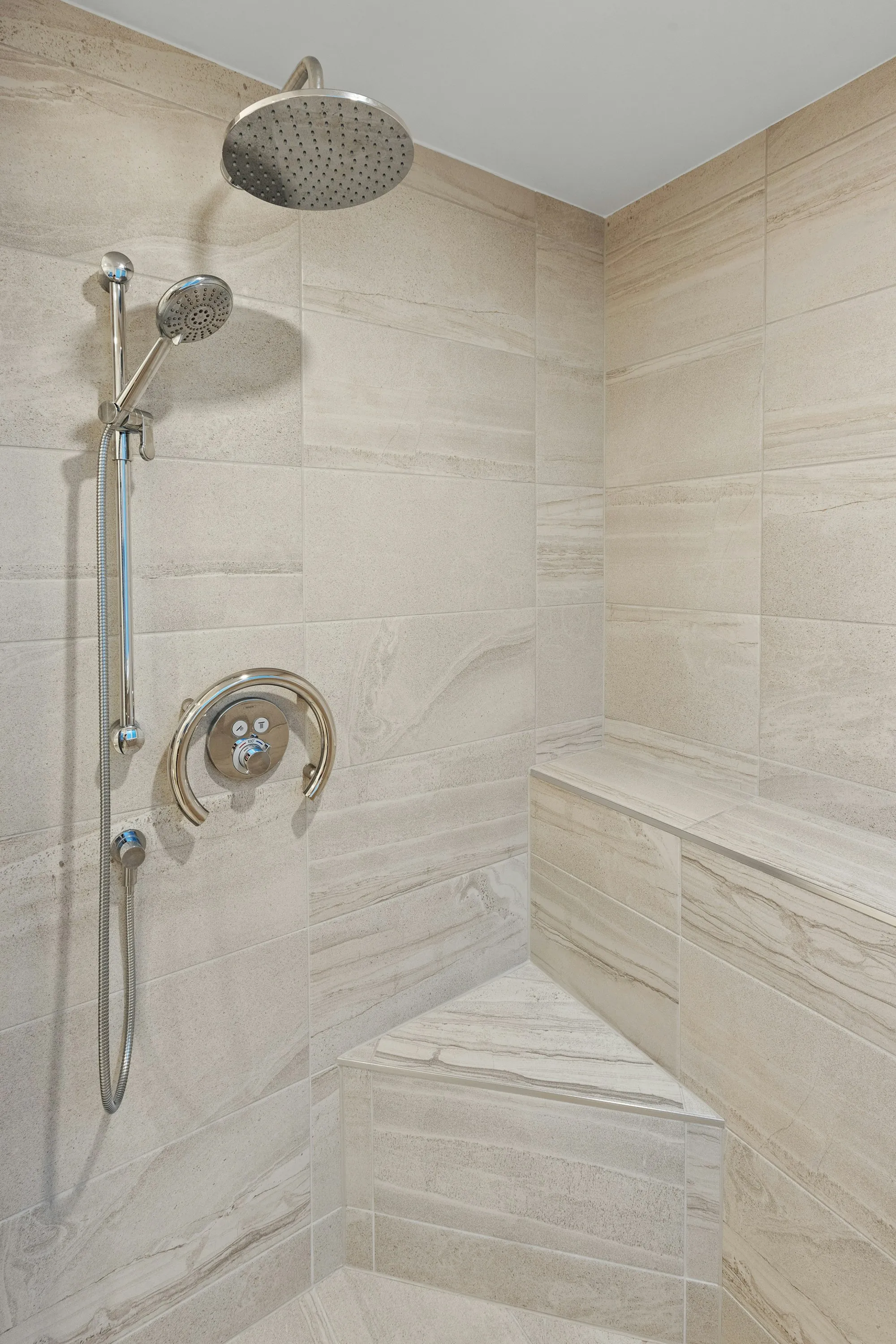 Tiled walk-in shower with a rainfall head
