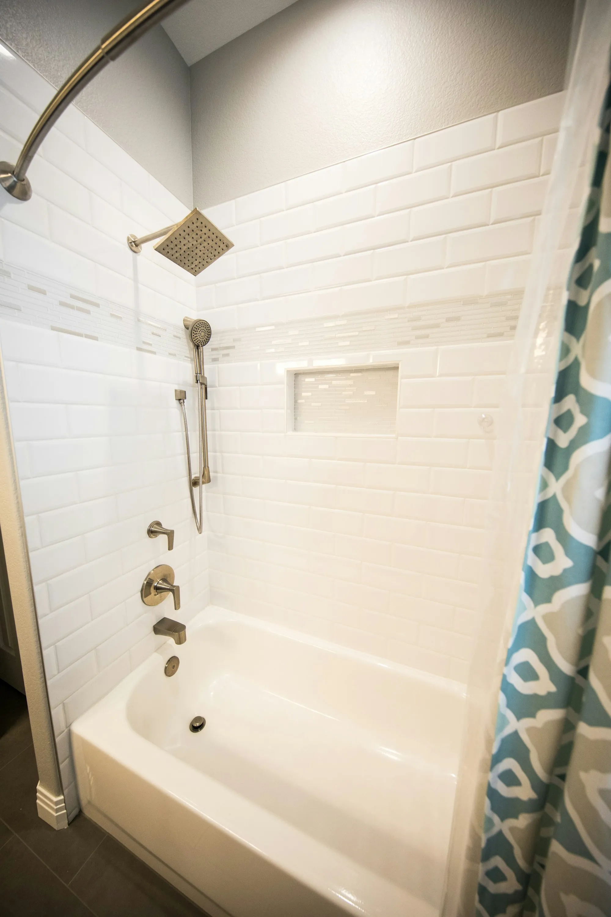 Remodeled bathroom with new tile and fixtures